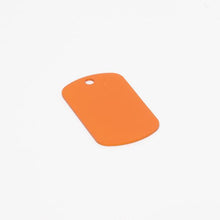 Load image into Gallery viewer, Orange, ready-to-machine anodized aluminum dog tag.
